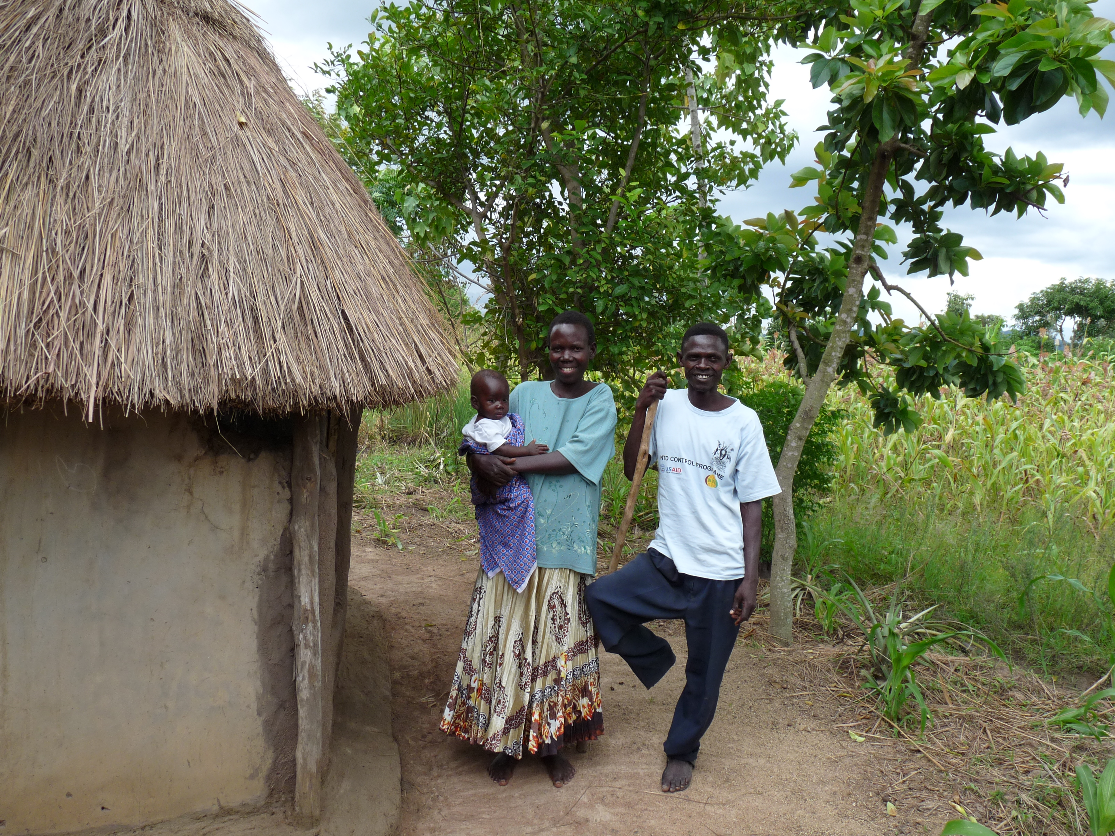 Samuel and his family proudly showing their latrine